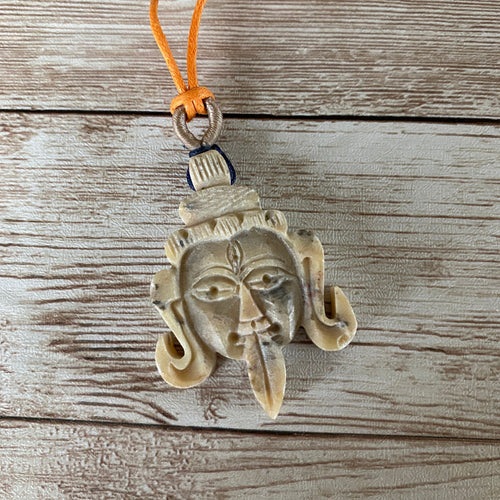 Carved Stone Kali Goddess Head Necklace with Orange Cord