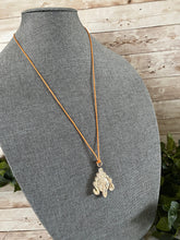Load image into Gallery viewer, Carved Stone Kali Goddess Head Necklace with Orange Cord
